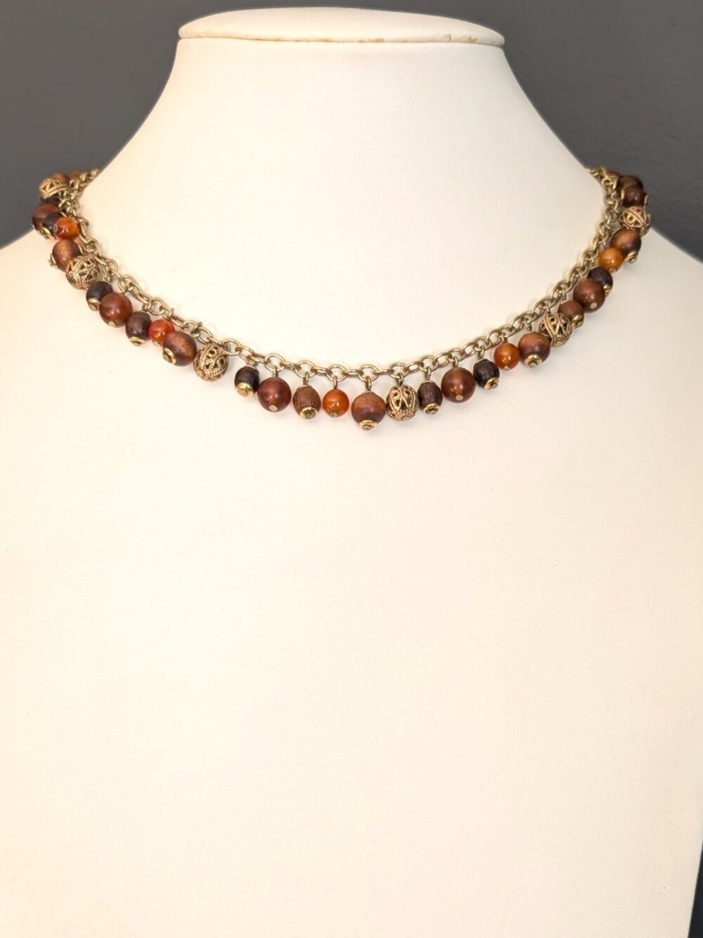 Gold, wood and shades of orange beaded choker necklace